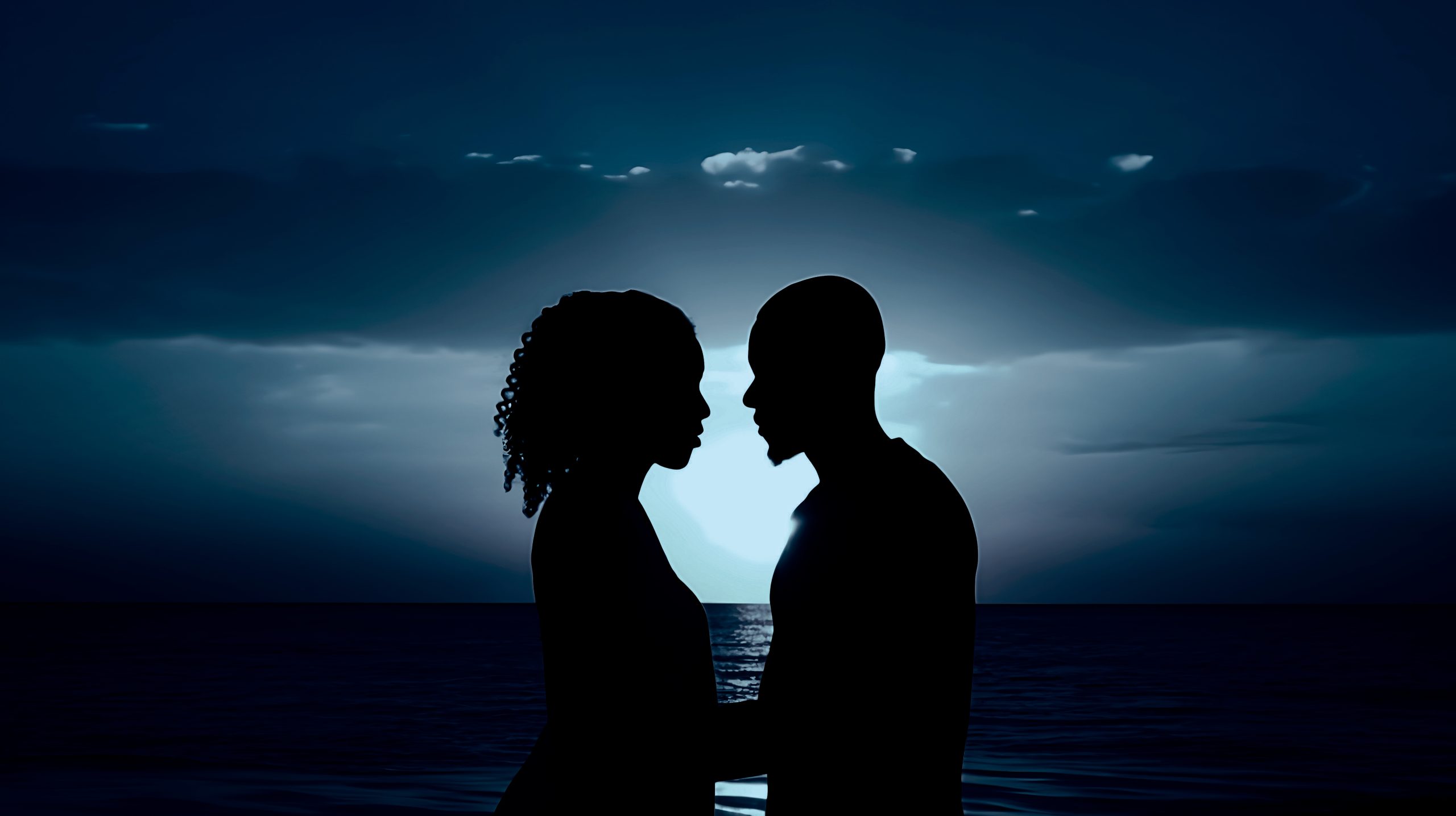 Couple smiling together with a dark sea background, symbolizing overcoming long-distance relationship challenges