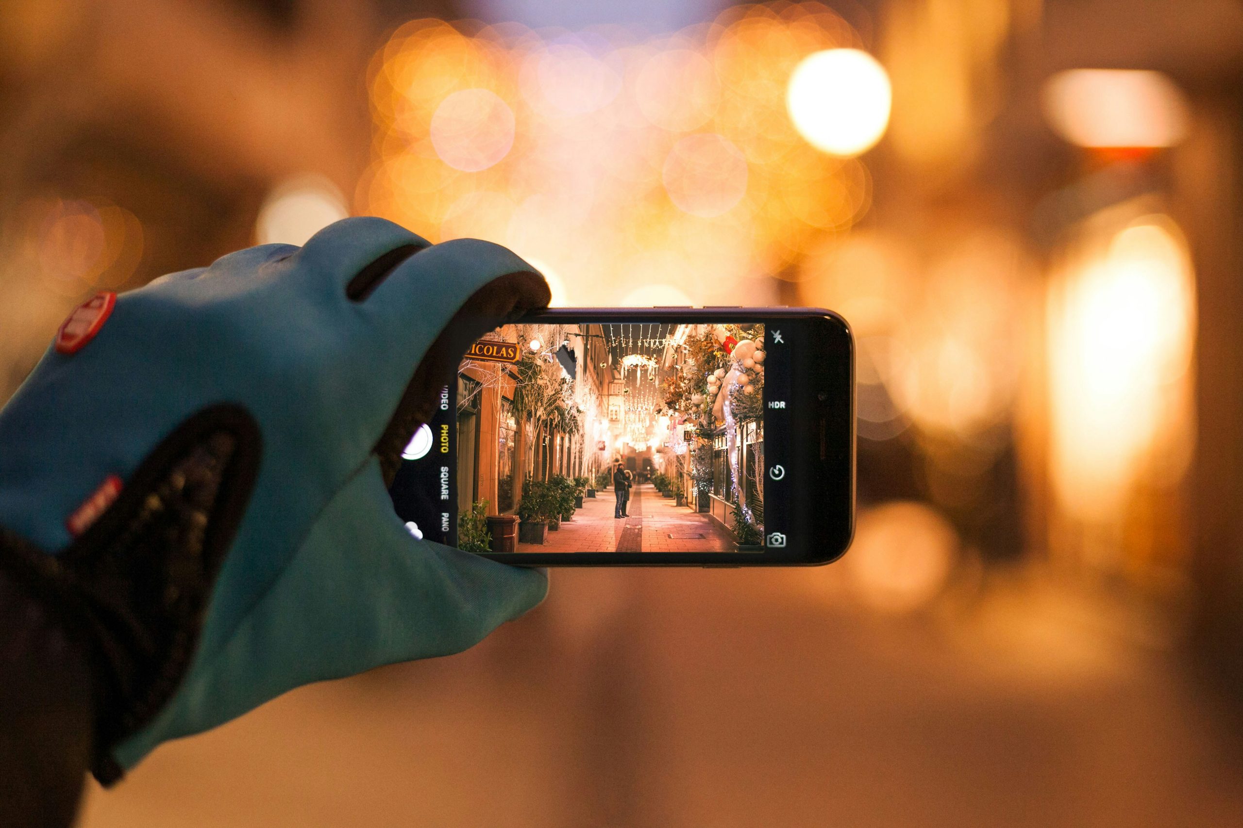 Couple taking a selfie with a smartphone, highlighting the balance between technology and relationships.